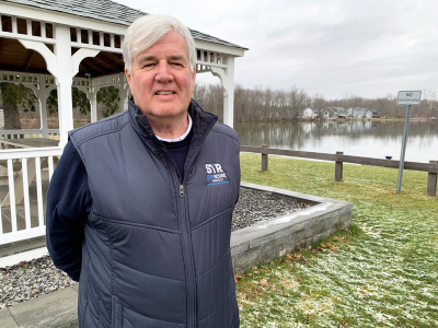 Clay Town Supervisor Damian Ulatowski stands next to a gazebo at Three Rivers Point. The town hopes to see the site turned into a waterfront community.